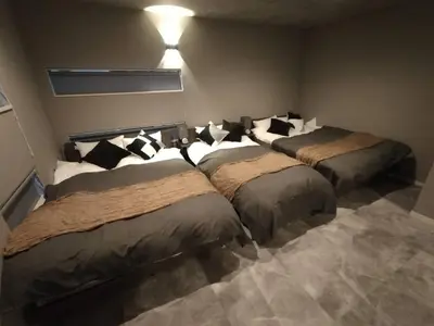 a room with three beds with pillows on them at 103, Higashi-Yotsugi 3A, Entire house for rent, \u6771\u56db\u3064\u67283A in Tokyo