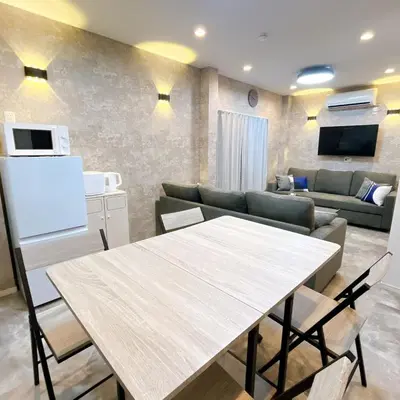 a kitchen and living room with a table and a couch at 103, Higashi-Yotsugi 3A, Entire house for rent, \u6771\u56db\u3064\u67283A in Tokyo