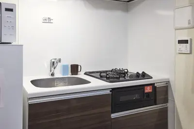 a kitchen with a sink and a stove at Uvas\u6c60\u888b in Tokyo