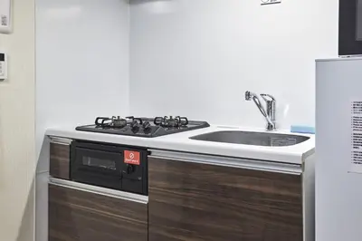 a kitchen with a stove and a sink at Uvas\u6c60\u888b in Tokyo