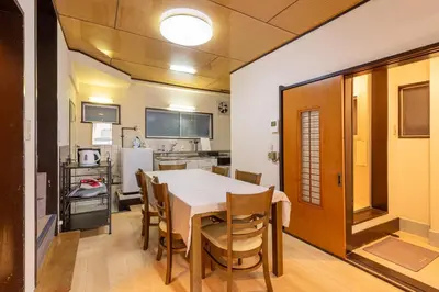 a kitchen and dining room with a table and chairs at \u5165\u82392\u4e01\u76ee\u6238\u5efa\u3066 in Tokyo