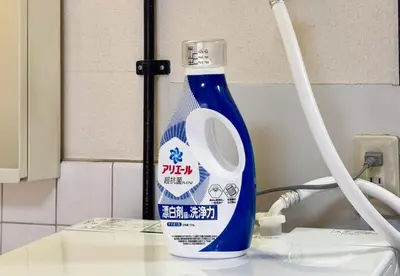 a blue bottle of cleaning cleaner sitting on a counter at \u5165\u82392\u4e01\u76ee\u6238\u5efa\u3066 in Tokyo