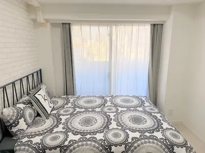 a bed in a bedroom with a window at S6 Shibuya center-350m from Shibuya st ation in Tokyo