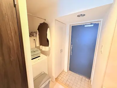 a bathroom with a toilet and a blue door at S6 Shibuya center-350m from Shibuya st ation in Tokyo