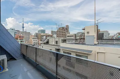 a view of a city skyline from a balcony at \u30db\u30c6\u30eb\u9759\u862d\u6cca\u9326\u7cf8\u753a in Tokyo