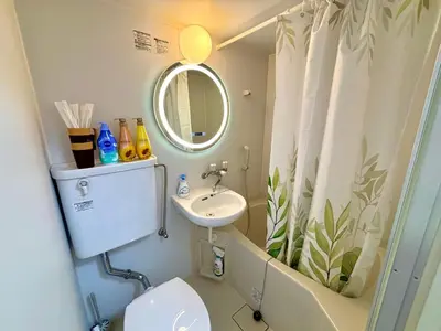 a bathroom with a sink and a toilet and a mirror at B2-Shinjuku center 3mins to ST Max 4P-\u65b0\u5bbf\u4e2d\u5fc3 \u5927\u4e45\u4fdd\u99c53\u5206\u949f \u8d85\u7ea7\u5546\u5708\u4ea4\u901a\u67a2\u7ebd \u6b65\u884c\u5230\u65b0\u5bbf\u6b4c\u821e\u4f0e\u753a \u5c71\u624b\u7dda\u76f4\u8fbe\u6e0b\u8c37\u9280\u5ea7\u6c60\u888b in Tokyo