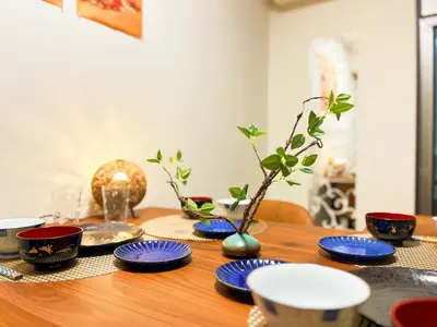 a wooden table with blue and white dishes on it at Zen House - Vacation STAY 18298 in Tokyo