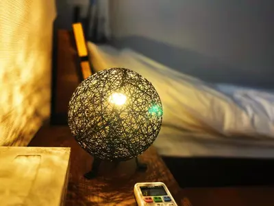 a lamp on a table next to a bed at Zen House - Vacation STAY 18298 in Tokyo