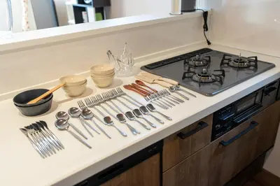 a kitchen counter with cooking utensils and a stove at Boasorte Urayasu in Tokyo