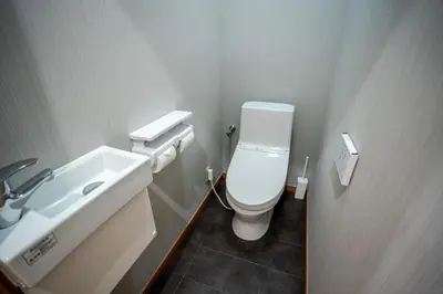 a bathroom with a white toilet and a sink at Shibuya 5Bedroom Private Villa 2Bath 2WC Up to 14 Guests in Tokyo
