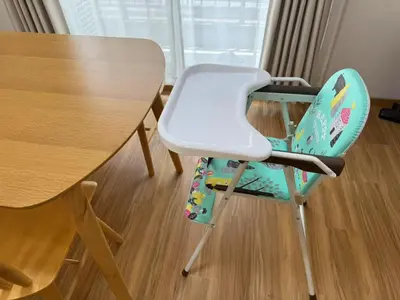 a blue and white chair next to a table at Shibuya 5Bedroom Private Villa 2Bath 2WC Up to 14 Guests in Tokyo