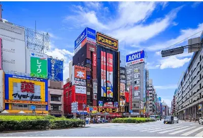 a busy city street with many tall buildings at \u6c60\u888b Aurora 7 in Tokyo