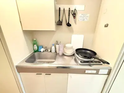 a small kitchen with a sink and a stove at \u6c60\u888b Aurora 7 in Tokyo