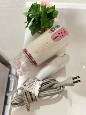 a couple of electric toothbrushes sitting on a counter at SOLASIA residence \u5317\u4e0a\u91ce402 in Tokyo