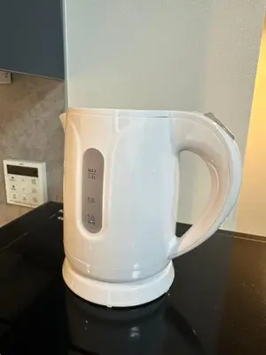 a white coffee cup sitting on top of a table at SOLASIA residence \u5317\u4e0a\u91ce402 in Tokyo