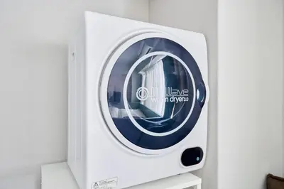 a white microwave oven sitting on top of a shelf at NC-302Yamanote Line shinjuku \u9ad8\u7530\u99ac\u5834 5mins walk Hostel! \u9ad8\u901fWi-fi! Waseda in Tokyo