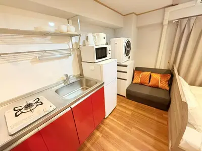 a small kitchen with a sink and a microwave at NC-302Yamanote Line shinjuku \u9ad8\u7530\u99ac\u5834 5mins walk Hostel! \u9ad8\u901fWi-fi! Waseda in Tokyo