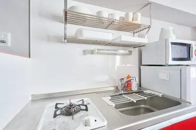 a kitchen with a sink and a stove at NC-302Yamanote Line shinjuku \u9ad8\u7530\u99ac\u5834 5mins walk Hostel! \u9ad8\u901fWi-fi! Waseda in Tokyo