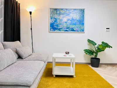 a living room with a couch and a table at Sugamo 1F-TS0334 in Tokyo