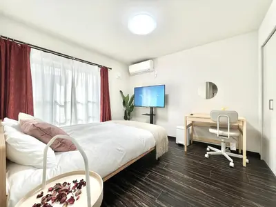 a bedroom with a bed and a desk and a computer at Sugamo 3F-TS0336 in Tokyo