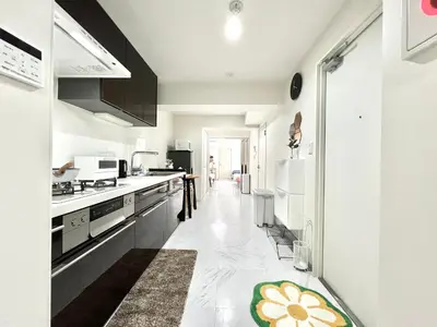 a kitchen with white counters and appliances in a room at Sugamo 3F-TS0336 in Tokyo