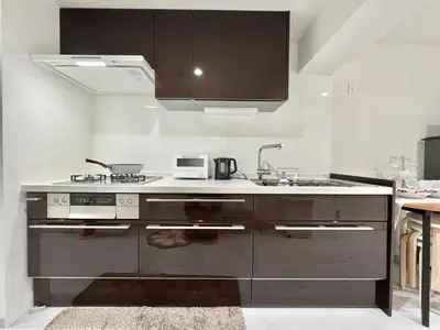 a kitchen with a sink and a stove top oven at Sugamo 3F-TS0336 in Tokyo