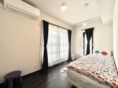 a bedroom with a bed and a large window at Sugamo 3F-TS0336 in Tokyo