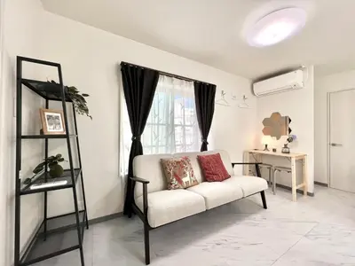 a living room with a white couch and a window at Sugamo 3F-TS0336 in Tokyo