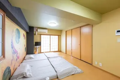 a large room with a large bed in it at \u5409\u7965\u5929 in Tokyo