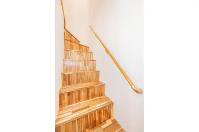 a set of wooden stairs in a room at Asakusa Stay Hotel in Tokyo