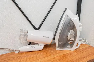 a hair dryer sitting on top of a table at Asakusa Stay Hotel in Tokyo