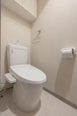 a bathroom with a toilet and a roll of toilet paper at Dash Living Osaki in Tokyo
