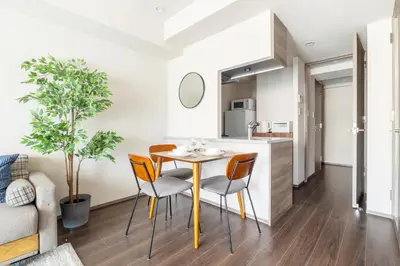 a kitchen and dining room with a table and chairs at Dash Living Osaki in Tokyo