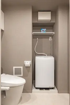 a bathroom with a toilet and a sink at Dash Living Osaki in Tokyo