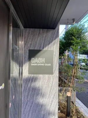 a sign on the side of a building at Dash Living Osaki in Tokyo