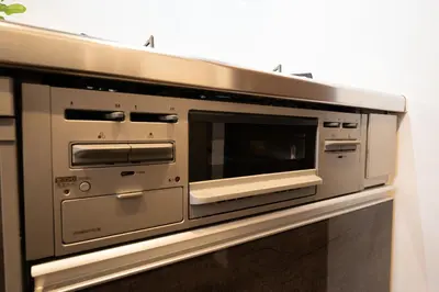 a microwave oven sitting on top of a wall at Takasago Utopia Hotel in Tokyo