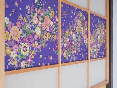 a painting of flowers on a blue wall at mori HOUSE-vacation rental in Tokyo