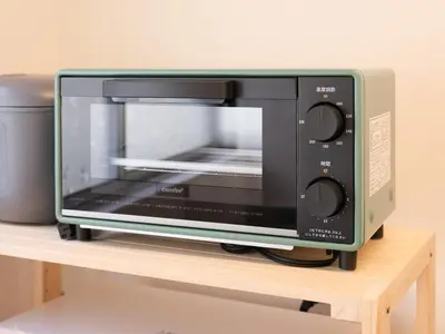a microwave oven sitting on top of a table at mori HOUSE-vacation rental in Tokyo