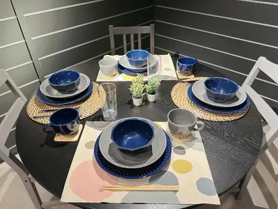 a table with blue bowls and plates on it at Worldtraveler Roppongi in Tokyo