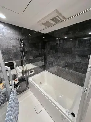 a bathroom with a white tub and a shower at Worldtraveler Roppongi in Tokyo