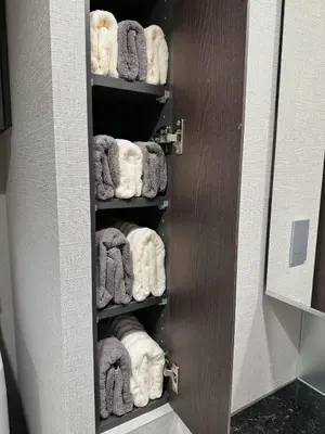 a towel rack in a bathroom with towels at Worldtraveler Roppongi in Tokyo