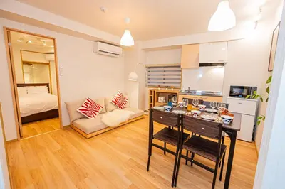 a room with a kitchen and a living room at Aurora1 in Tokyo