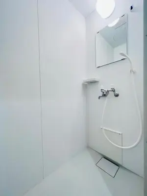a white bathroom with a sink and a mirror at Higashinakano House NN0021 in Tokyo