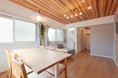 a dining room with a wooden table and chairs at V Close to Shinjuku Kabukicho Korean Town FrWIFI J in Tokyo