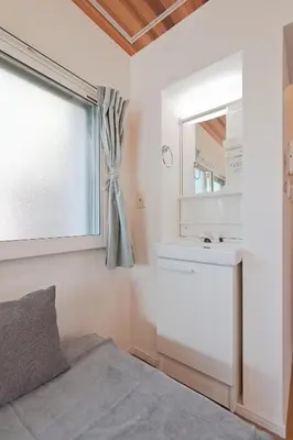a bedroom with a bed and a sink and a mirror at V Close to Shinjuku Kabukicho Korean Town FrWIFI J in Tokyo