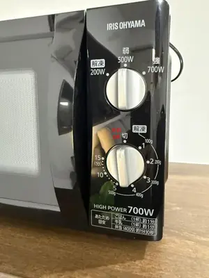 a control panel of a toaster oven on a table at \u98a8\u82b1Fuka\u6c11\u6cca\u5927\u68ee\u897f002 in Tokyo