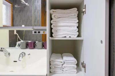 a bunch of towels in a bathroom closet at Nakano Shinjuku Sapphire Single-family House in Tokyo
