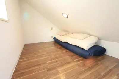 a small room with a bed in the attic at UT Apart Ikebukuro \u6c60\u888b\u99c5\u5f92\u6b6910\u5206 in Tokyo