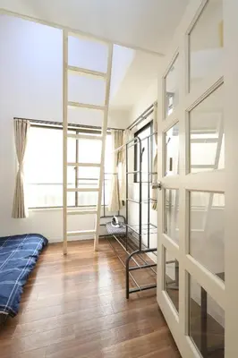 a bedroom with bunk beds and a window at UT Apart Ikebukuro \u6c60\u888b\u99c5\u5f92\u6b6910\u5206 in Tokyo