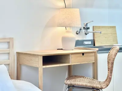 a desk with a lamp and a chair next to a bed at shinjuku yichun hostel-SJ0399 in Tokyo